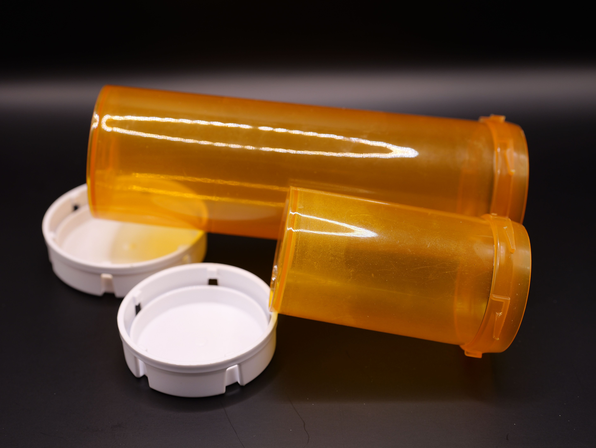 Closeup of empty medical prescription bottles