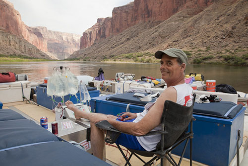 The iconic photo of Bill dialyzing on a raft in the middle of the Colorado river.