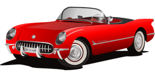 A red car with a convertible top Description automatically generated