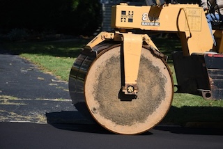 A close-up of a road roller Description automatically generated