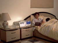 Woman Reading a Book in Bed.